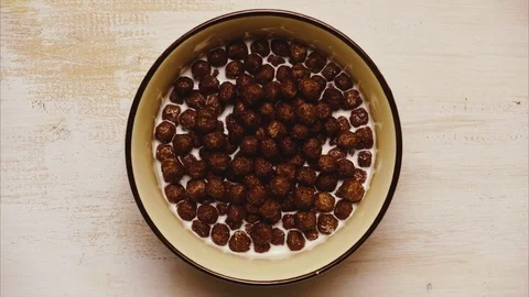 Dry finished chocolate breakfast balls. Stop motion, animation Stock Footage 73961310