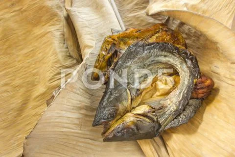 Dry fish on dry banana leaf Stock Photos