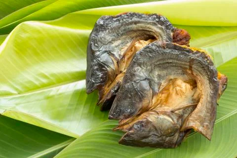 Dry fish on  fresh banana leaf Stock Photos