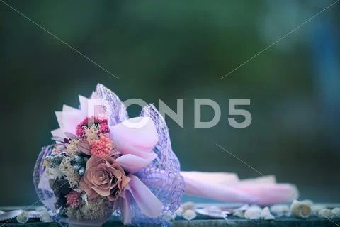 Dry flowers bouquet lying on wood table with blurry background Stock Photos