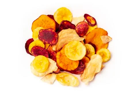 Dry fruit and vegetable chips, healthy vegan snack, a mixed heap on a white Stock Photos
