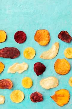 Dry fruit and vegetable chips, shot from above with a place for text. Healthy Photos