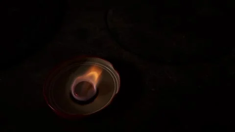 Dry fuel tablet burning on a vintage stove surface, high angle view Stock Footage 331052857