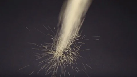 Dry grain falls on a black table. Yellow groats pour in. View from above Stock Footage 120451879