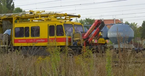 Dry Grass Is On The Foreground Yellow Special Rolling Stock Stands On The Stock Footage 54839109