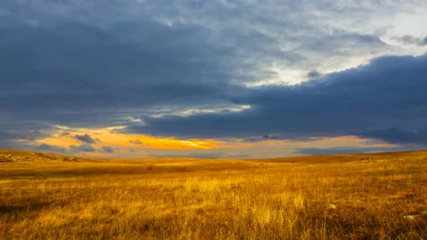 Dry grass prairie at the dramatic sunset, time lapse scene Stock Footage 146688916