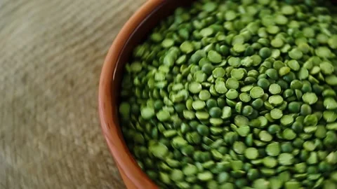 Dry green peas in a bowl. Split green peas. Peas on a wooden background. Stock Footage 183540774