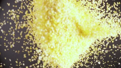 Dry groats fall down from under the camera slow motion Stock Footage 90958438