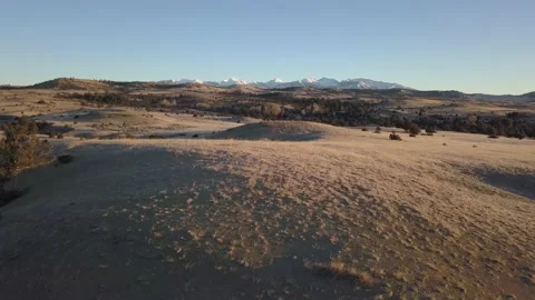 Dry hills with mountains in background Stock Footage 166527089