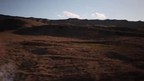 Dry hills at sunset motion Stock Footage 331199792