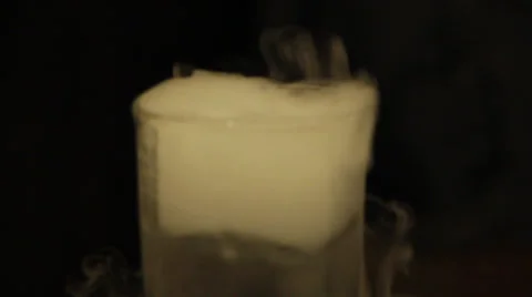 Dry ice effect in drinking glass Stock Footage 37569833