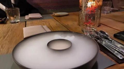 Dry ice on the fancy restaurant table in 4K Stock Footage 231629592