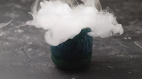 Dry ice fog flow from the blue ceramic cup. Stock Footage