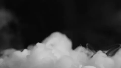 Dry ice rising up on a black background Stock Footage 229401829