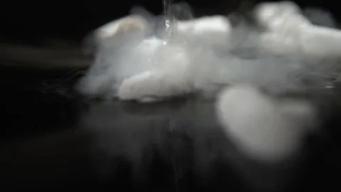 Dry ice with water and it's chemical rea... | Stock Video | Pond5