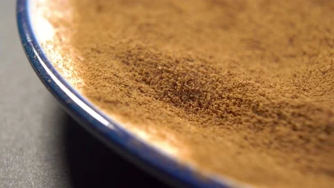 Dry instant chicory root powder in saucer. Macro Stock Footage 178415412