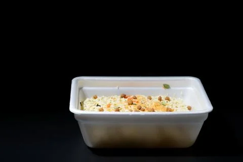 Dry instant noodles in rectangle plastic plate, top view Stock Photos