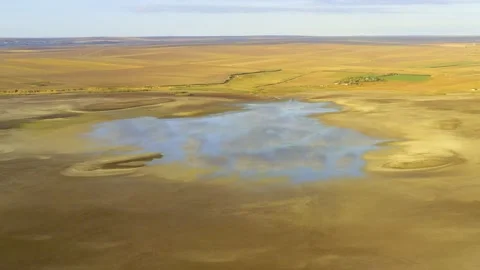 Dry lake or swamp in the process of drought and lack of rain - aerial drone view Stock Footage 142901368