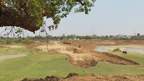 Dry Lakebed with Excavation Work and Sparse Water Patches 動画素材 333994732