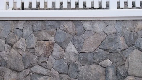 Dry leaves spin by wind before falling down to the road Video stock 128100435