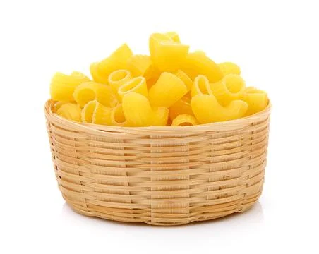 Dry macaroni in the basket on white background Fotos de archivo