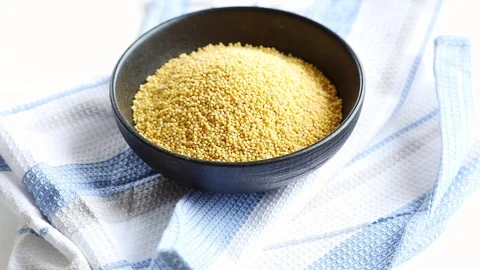 Dry millet in  bowl  Stock Footage 88963464