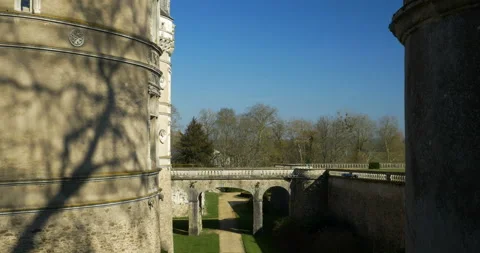 Dry moat of Le Lude Castle during spring walk under blue sky, family historical Stock Footage 103821285