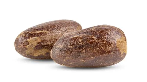 Dry nutmeg on white background Stock Photos