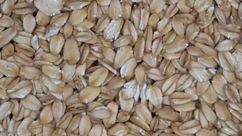 Dry oat flakes grains background, close up rotation loopable 4k top view, macro 스톡 동영상 93787414