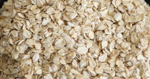 Dry oat flakes grains rotating on black background 3 Stock Footage 146988596