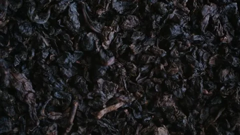 Dry oolong tea leaves rotating macro view 動画素材 337830701