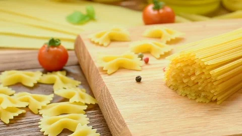 Dry pasta with cherry tomatoes and basil Video stock 72583594