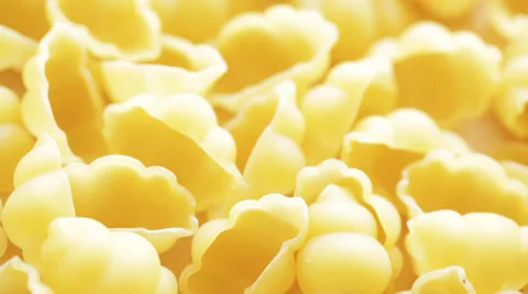 Dry pasta "gnocchi" on rotating display; close up Stock Footage 35931270