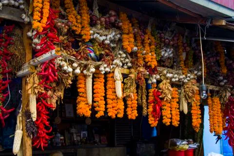 Dry pepper and other paces hanging in the outdoor market Stock Photos