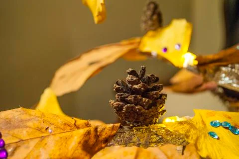 Dry pine cone and multi color leaves christmas tree natural decoration closeup. Stock Photos