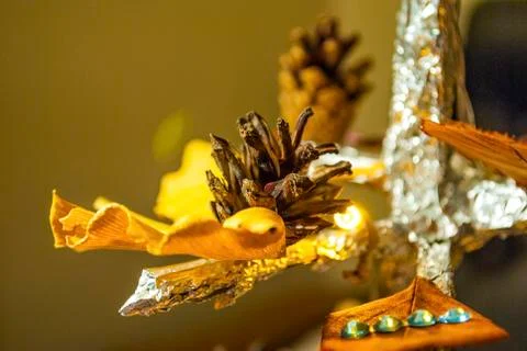 Dry pine cone and multi color leaves christmas tree natural decoration closeup. Stock Photos