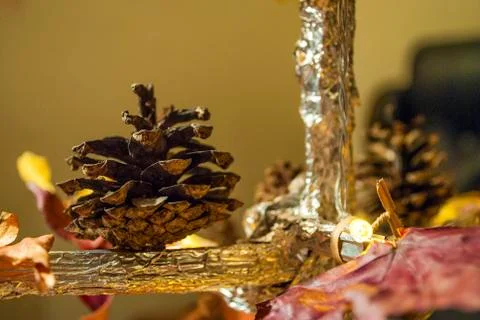 Dry pine cone and multi color leaves christmas tree natural decoration closeup. 스톡 사진