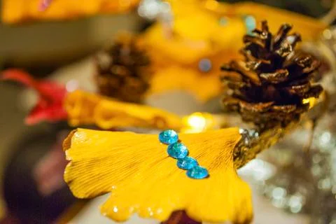 Dry pine cone and multi color leaves christmas tree natural decoration closeup. Stock Photos