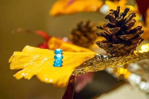 Dry pine cone and multi color leaves christmas tree natural decoration closeup. Stock Photos