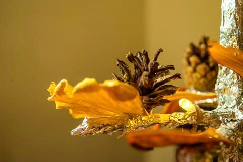 Dry pine cone and multi color leaves christmas tree natural decoration closeup. 스톡 사진