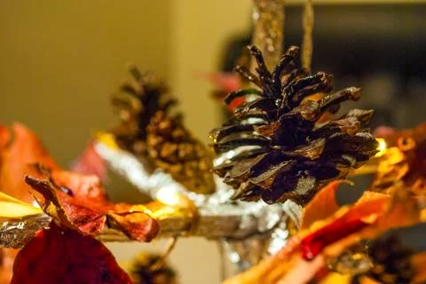 Dry pine cone and multi color leaves christmas tree natural decoration closeup. 스톡 사진