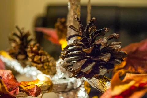 Dry pine cone and multi color leaves christmas tree natural decoration closeup. 스톡 사진