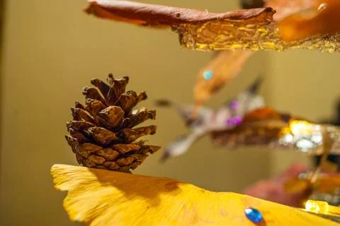 Dry pine cone and multi color leaves christmas tree natural decoration closeup. Stock Photos