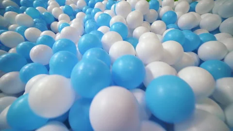 Dry pool with bright colorful plastic balls for small kids, childrens playground Stock Footage 197365567