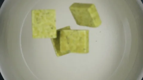Dry pressed broth in cubes. Slow motion. Top view Video stock 75229518