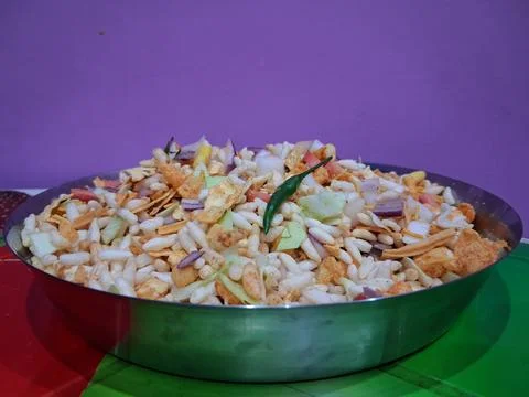 Dry puffed rice grams mixture Mixed Vegetable Jhal Muri on Purple Background Stock Photos
