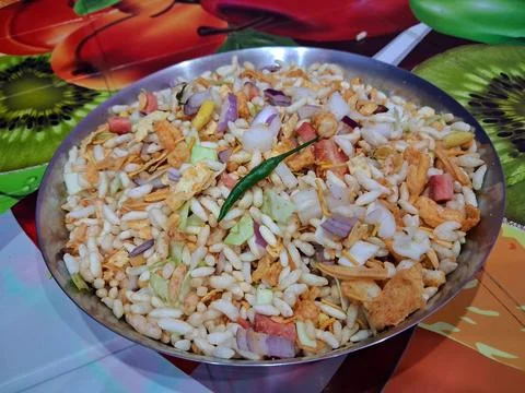 Dry puffed rice grams mixture Mixed Vegetable Jhal Muri on Purple Background Stock Photos