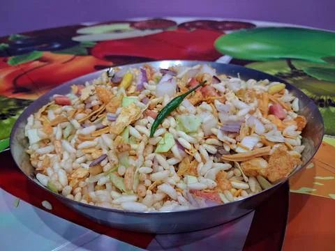 Dry puffed rice grams mixture Mixed Vegetable Jhal Muri on Purple Background Stock Photos