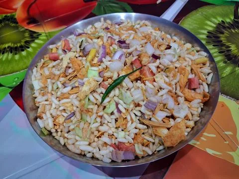 Dry puffed rice grams mixture Mixed Vegetable Jhal Muri on Purple Background Stock Photos