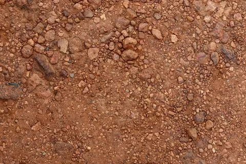 Dry Red Laterite Soil Texture with Small Pebbles 库存照片